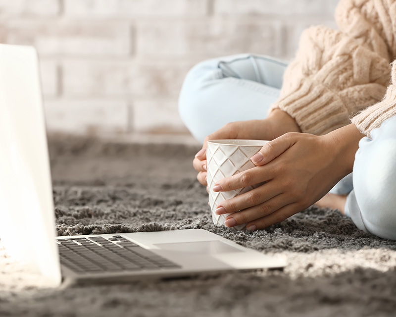 Young woman in front of a laptop for infertility counseling