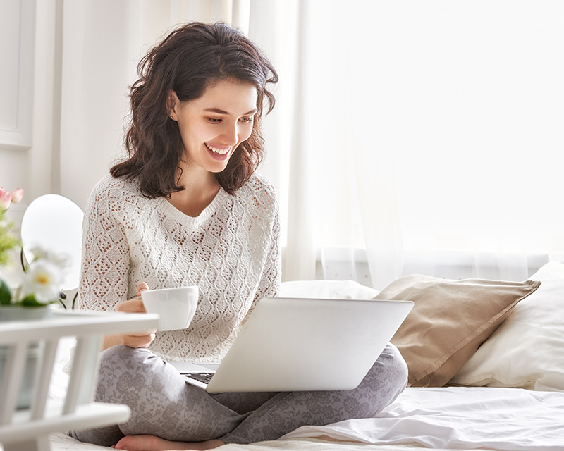 Woman on a laptop for therapy with Christina Rush, PhD